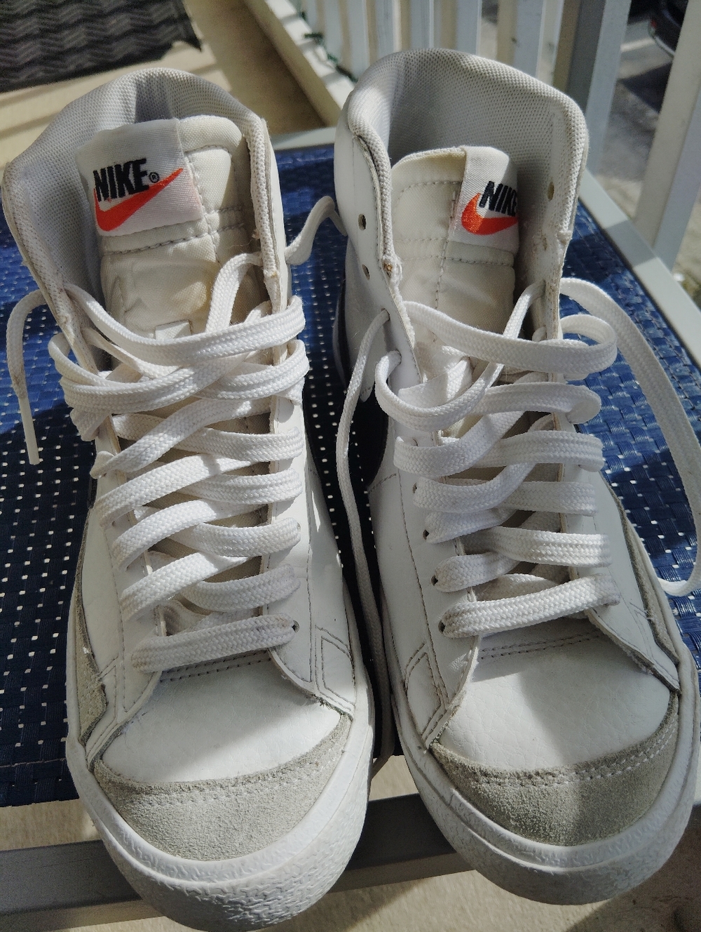 Nike High-Top Sneakers in White with Black Swoosh